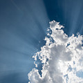 Blue sky with white clouds and  sun rays
