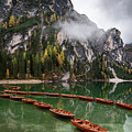 Wooden boats on the peaceful  lake. Lago di braies, Italy
